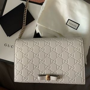 Gucci monogram crossbody wallet on chain